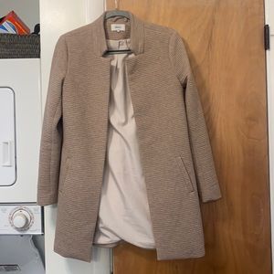 Tan coat, lightly worn